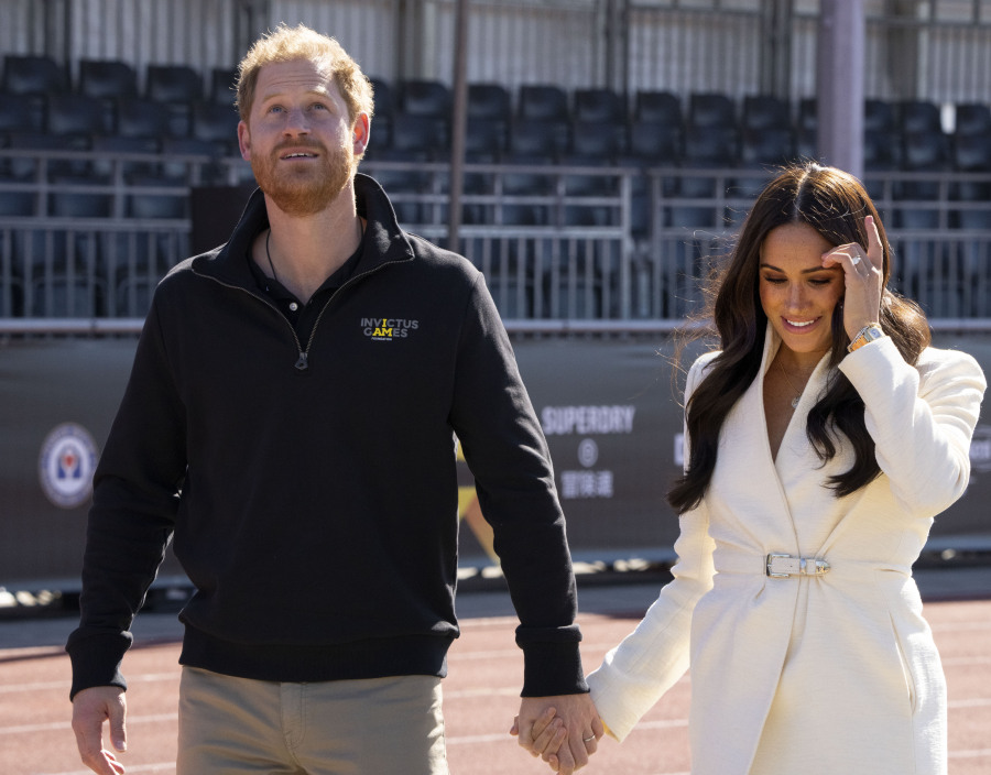 FILE - Prince Harry and Meghan Markle, Duke and Duchess of Sussex at the Invictus Games in The Hague, Netherlands, Sunday, April 17, 2022.  A spokesperson for Prince Harry and his wife Meghan says the couple were involved in a car chase while being followed by photographers. The couple's office says the pair and Meghan's mother were followed for more than two hours by a half-dozen vehicles after leaving a charity event in New York on Tuesday, May 16, 2023.