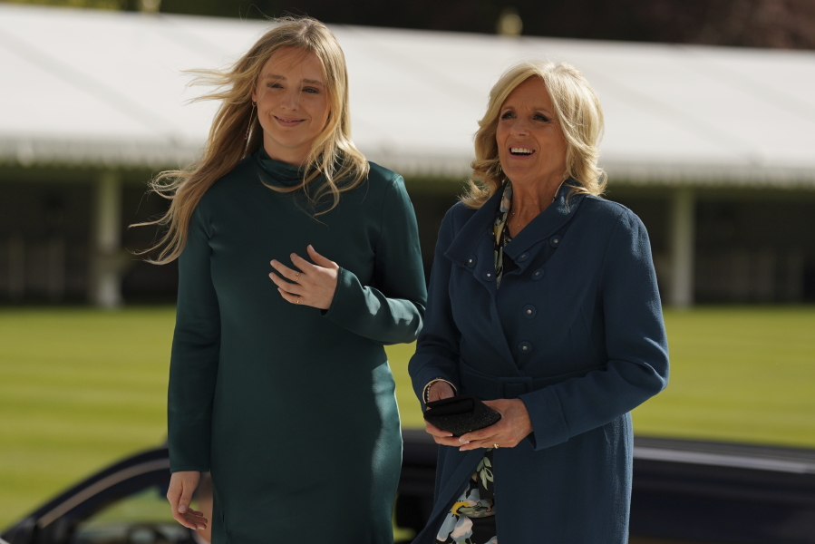 The First Lady of the United States, Jill Biden, right, and her grand daughter Finnegan Biden arrive at Buckingham Palace in London Friday May 5, 2023, for a reception hosted by Britain's King Charles III, for overseas guests attending his coronation.
