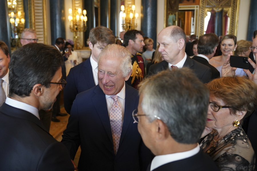 Britain's King Charles III, speaks to guests during a reception at Buckingham Palace, in London, Friday May 5, 2023 for overseas guests attending his coronation.