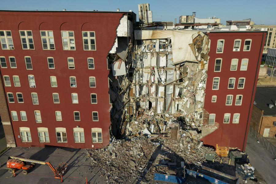 An apartment building that partially collapsed two days earlier can be seen Tuesday, May 30, 2023, in Davenport, Iowa. Five residents of the six-story apartment building remained unaccounted for and authorities fear at least two of them might be stuck inside rubble that was too dangerous to search.