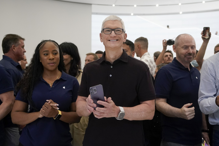 FILE - Apple CEO Tim Cook smiles at an Apple event in Cupertino, Calif., on Sept. 7, 2022. After ballooning for years, CEO pay growth is finally slowing. Cook, who was number three in the AP CEO pay survey, requested a 40% pay cut in 2023 after shareholders questioned the size and structure of his $99.4 million compensation package in 2022.