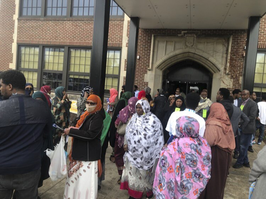 This photo provided by Bridget Siljander shows people as they evacuate the Ella Baker Center in Minneapolis, Saturday, May 13, 2023, after a brawl broke out over nominations for a Minneapolis City Council seat. At least two people were injured during the confrontation inside.