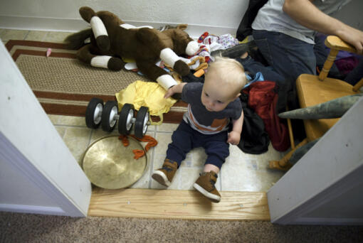 Cal Sabey, 1, plays at a relative's home in Centennial, Colo., Wednesday, May 3, 2023. His parents, Sarah Perkins and Joshua Sabey, are suing police and social workers in Massachusetts after their two young children were taken by the state's Department of Children and Families in July 2022. Hospital staff discovered that Cal had suffered a broken rib and flagged the couple for possible child abuse. The couple's lawsuit alleges constitutional violations including the unreasonable search of their house, the unreasonable seizure of their children and the deprivation of parental rights without due process.