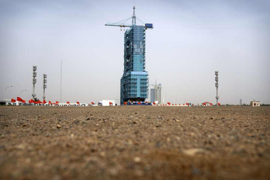 The Shenzhou-16 spacecraft sits atop a Long March rocket covered on a launch pad at the Jiuquan Satellite Launch Center in northwest China on Monday, May 29, 2023. China's space program plans to land astronauts on the moon before 2030, a top official with the country's space program said Monday.