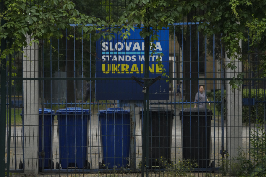 A billboard showing a support for Ukraine on display in between fences at the Slovakia Embassy in Beijing, Thursday, May 17, 2023. Embassies in Beijing have been asked by the Chinese government to avoid displaying propaganda after some raised Ukrainian flags or set up placards declaring support for Ukraine.
