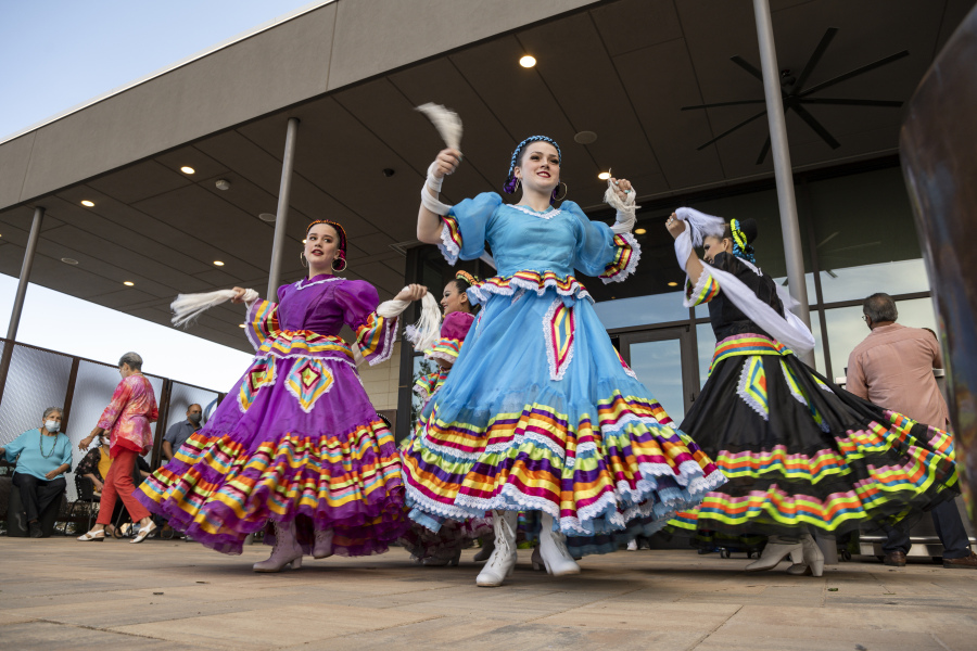 FILE -Young Folklorico dancers from the group Viva Mexico begin their dance routine at a Cinco de Mayo celebration hosted by the Odessa Hispanic Chamber of Commerce at the Odessa Marriott Hotel and Convention Center, Wednesday, May 5, 2021, in Odessa, Texas. American bars and restaurants gear up every year for Cinco de Mayo, offering special deals on Mexican food and alcoholic drinks for the May 5 holiday that is barely celebrated south of the border.