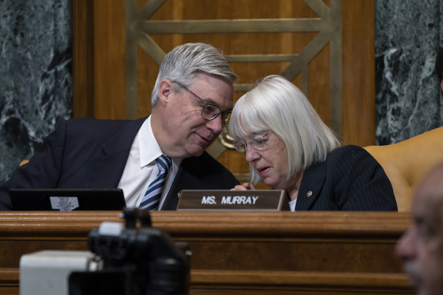Senate Budget Committee Chairman Sheldon Whitehouse, D-R.I., confers with Sen. Patty Murray, D-Wash., right, during a hearing on the Republican proposal to address the debt limit which passed along party lines in the House last week, at the Capitol in Washington, Thursday, May 4, 2023. Senate Democrats are looking to pressure Republicans into resolving the impasse on the debt ceiling. (AP Photo/J.