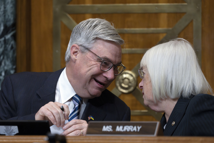 Senate Budget Committee Chairman Sen. Sheldon Whitehouse, D-R.I., confers with Sen. Patty Murray, D-Wash., right, during a hearing on the Republican proposal to address the debt limit which passed along party lines in the House last week, at the Capitol in Washington, Thursday, May 4, 2023. Senate Democrats are looking to pressure Republicans into resolving the impasse on the debt ceiling. (AP Photo/J.