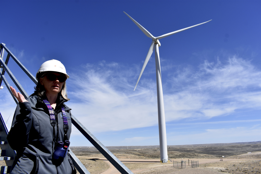 Environmental Development Director Misti Sporer of Duke Energy is seen on an observation tower at the company's Top of the World wind farm, on April 24, 2023, in Rollings Hills, Wyo. Sporer said the company has reduced, but not eliminated, collisions of eagles into turbines by installing a computerized camera network that detects incoming birds.