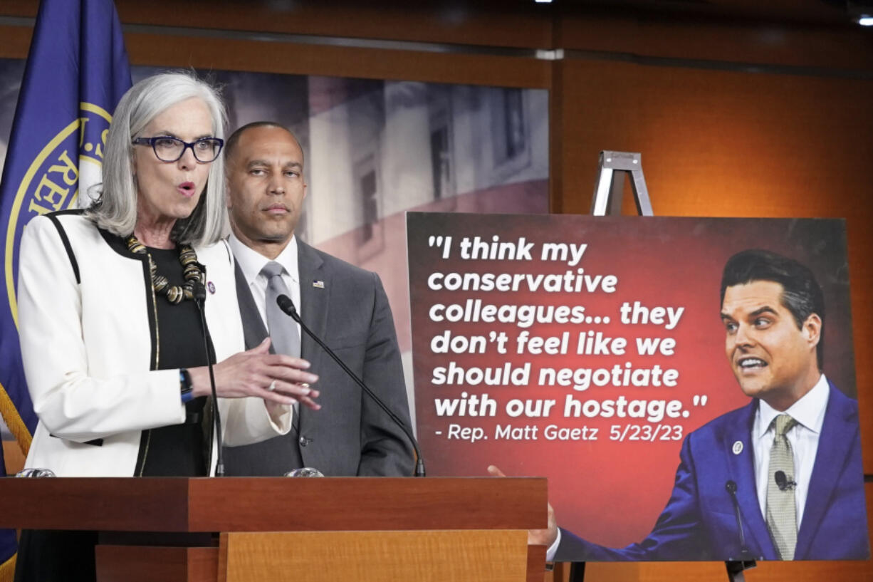 Rep. Katherine Clark, D-Mass., left, speaks as Democratic Caucus Chair Rep. Hakeem Jeffries, D-N.Y., right, listens during a news conference Wednesday, May 24, 2023, on Capitol Hill in Washington.