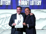 San Antonio Spurs managing partner Peter J. Holt, left, stands with NBA Deputy Commissioner Mark Tatum after Tatum announced that the Spurs won the first pick in the NBA draft, at the draft lottery in Chicago, Tuesday, May 16, 2023. (AP Photo/Nam Y.