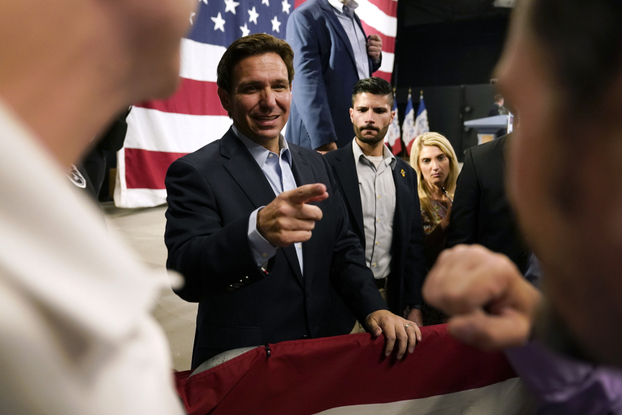 Republican presidential candidate Florida Gov. Ron DeSantis greets audience members during a campaign event, Tuesday, May 30, 2023, in Clive, Iowa.