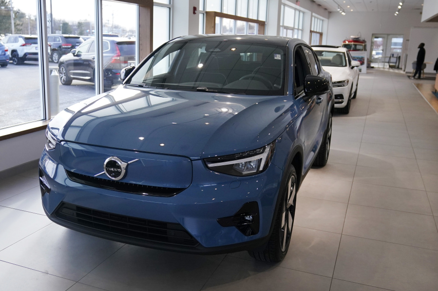 A 2023 Volvo C40 electric vehicle is displayed at a dealership, Tuesday, Feb. 7, 2023, in Exeter, N.H. Leasing is starting to look like the cheapest way to get an electric vehicle, because the U.S. government is giving it a big advantage. Dealers can apply up to the full $7,500 U.S.