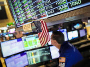 A trader works the floor at the New York Stock Exchange, Friday, May 26, 2023, in New York.