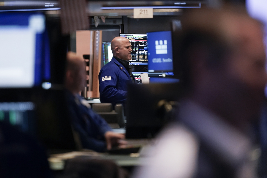 Traders work on the floor at the New York Stock Exchange in New York, Wednesday, May 3, 2023.  Stocks are drifting ahead of what Wall Street hopes will be the last hike to interest rates for a long time.
