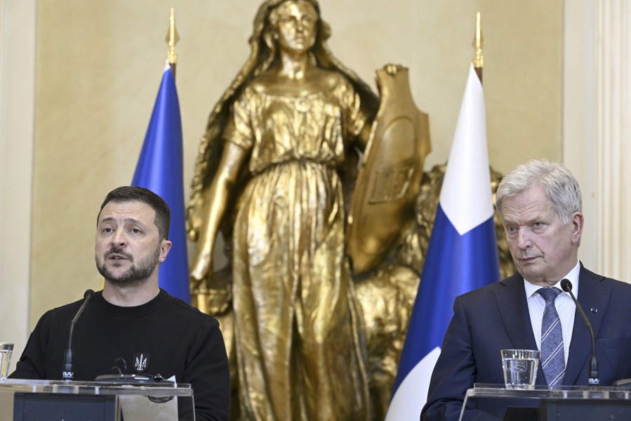 Ukrainian President Volodymyr Zelensky, left, and Finnish President Sauli Niinist, right, address the media during a press conference as part of the Nordic-Ukrainian summit at the Presidential Palace in Helsinki, Finland, Wednesday, May 3, 2023.