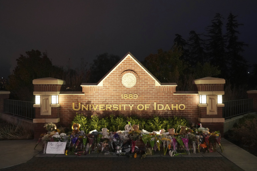 FILE- Flowers and other items are displayed at a growing memorial in front of a campus entrance sign for the University of Idaho, Wednesday, Nov. 16, 2022, in Moscow, Idaho. The family of Madison Mogen, one of four University of Idaho students killed in a stabbing attack last fall, wanted to celebrate her birthday by created Maddie May Day, urging people to commit random acts of kindness in Mogen's memory every May 25. (AP Photo/Ted S.