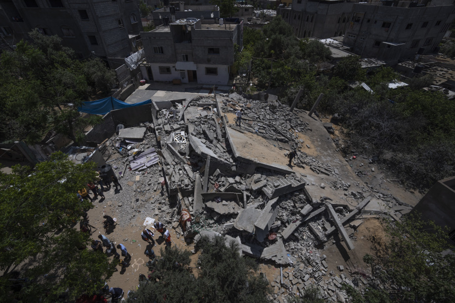 A view of the ruins of Nabhan's family home, which was destroyed in an Israeli airstrike, in Jabaliya, northern Gaza Strip, Sunday, May 14, 2023. The airstrike left 42 members of the extended family homeless. It also left four children with special needs without their wheelchairs, crutches and medical equipment needed to move about. Israel says the building was used as a command center by the Islamic Jihad militant group. The two sides reached a cease-fire Saturday to end five days of fighting.