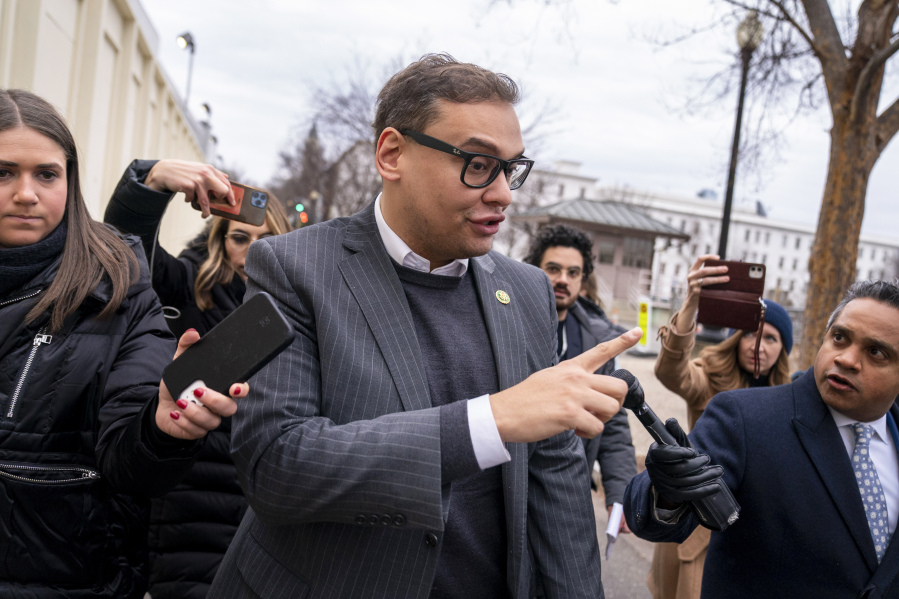 FILE - Rep. George Santos, R-N.Y., leaves a House GOP conference meeting on Capitol Hill in Washington, Jan. 25, 2023. Santos has been arrested on federal criminal charges. The indictment says Santos induced supporters to donate to a company under the false pretense the money would be used to support his campaign.