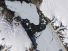 This Aug. 16, 2010, image provided by NASA Earth Observatory shows a piece of the Petermann Glacier that cracked in Greenland. A study in the Proceedings of the National Academy of Sciences on Monday, May 8, 2023, found that tides and climate change are rapidly melting ice in the grounding line zone of the Petermann Glacier. That's the point where glaciers go from being on land to floating on water.