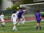 Heritage's Martin Estrada-Alvarez plays a header in front of the Central Kitsap goal during the Timberwolves' 2-1 loss to Central Kitsap in a 3A bi-district boys soccer playoff on Saturday, May 6, 2023.