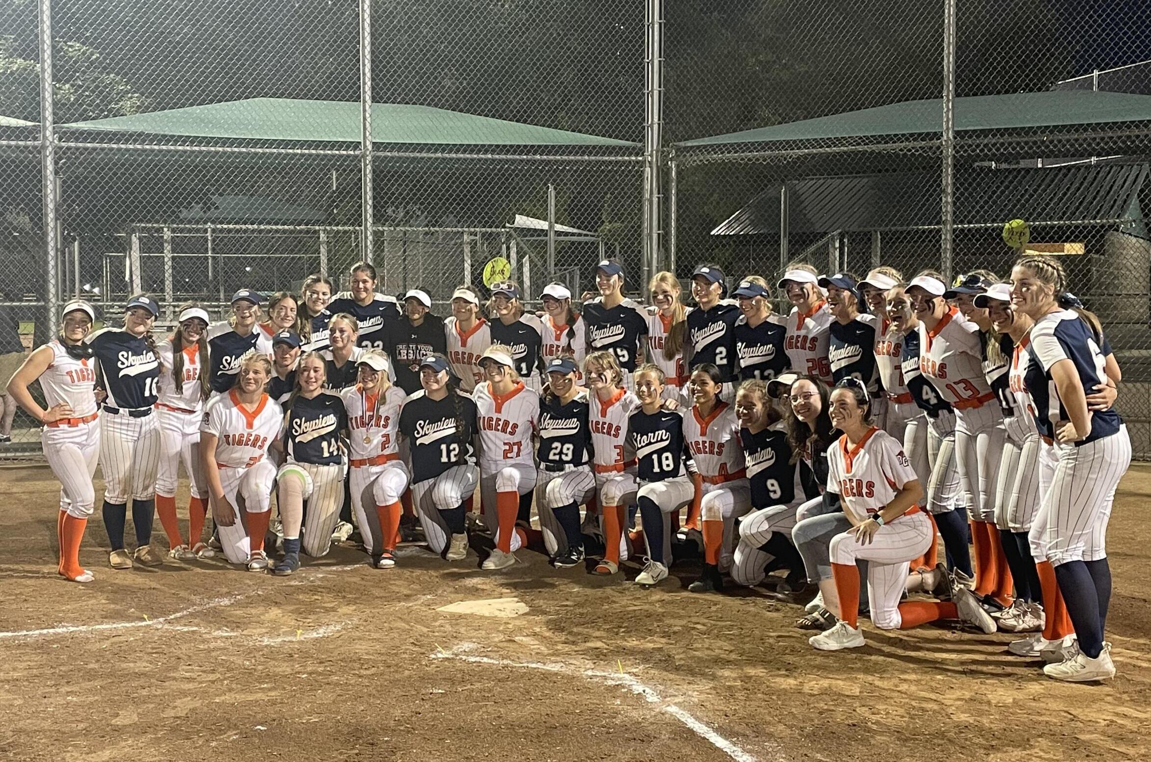 Battle Ground and Skyview players pose for photos after both 4A Greater St. Helens League teams saw their seasons come to an end at the Class 4A state softball tournament on Friday, May 26, 2023, in Richland.