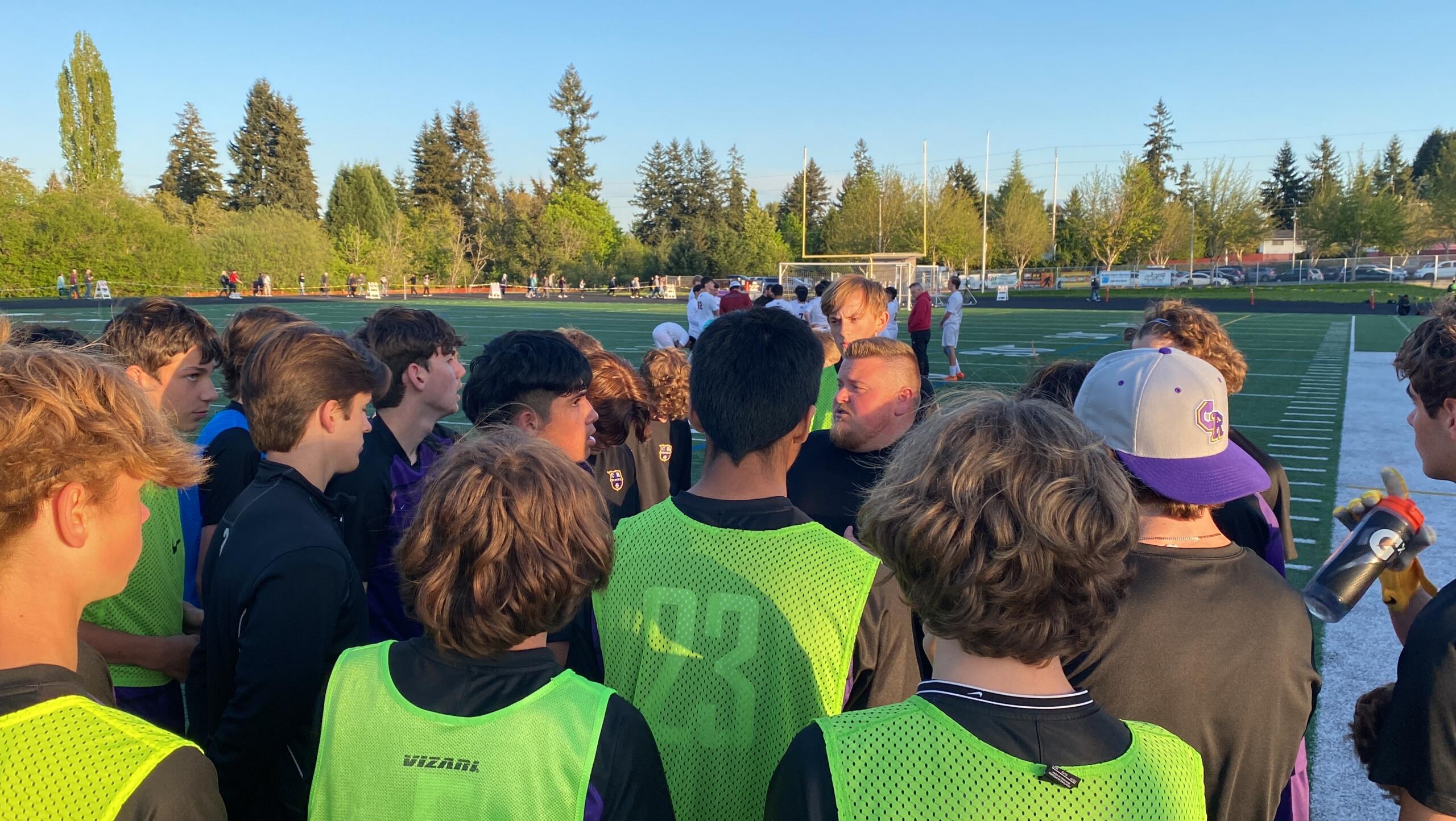 First-year Columbia River boys soccer coach Matt Newman addresses his team after Tuesday's 3-1 victory over W.F. West in their 2A District IV semifinal match. The win clinches a 2A state berth for the Rapids (19-0-0), who face Aberdeen on Thursday.