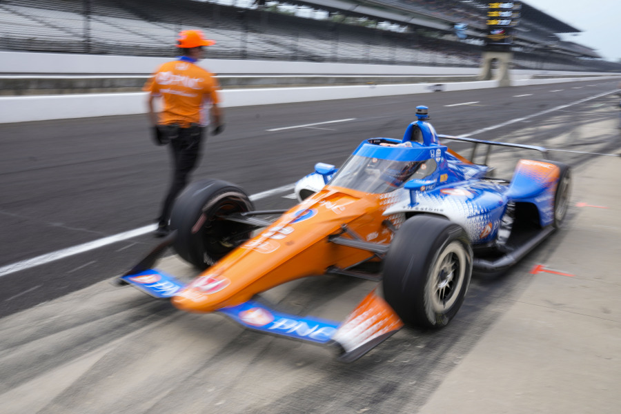 Scott Dixon, of New Zealand, drives out of the pit area during practice for the Indianapolis 500 auto race at Indianapolis Motor Speedway in Indianapolis, Friday, May 19, 2023.