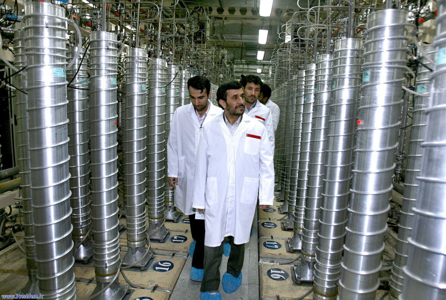 FILE - In this photo released by the Iranian President's Office, then-Iranian President Mahmoud Ahmadinejad, center, visits the Natanz Uranium Enrichment Facility near Natanz, Iran, April 8, 2008. A new underground facility at the Natanz enrichment site may put centrifuges beyond the range of a massive so-called "bunker buster" bomb earlier developed by the U.S. military, according experts and satellite photos analyzed by The Associated Press in May 2023.