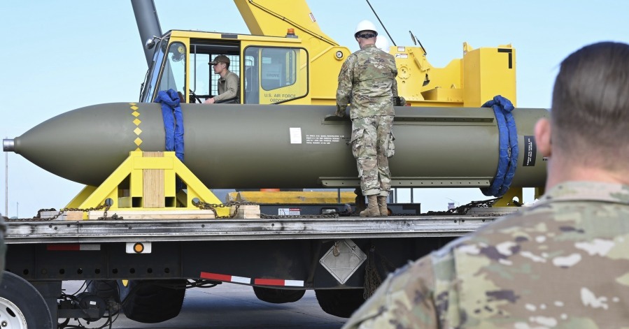 In this photo released by the U.S. Air Force on May 2, 2023, airmen look at a GBU-57, or the Massive Ordnance Penetrator bomb, at Whiteman Air Base in Missouri. That U.S. bomb, designed to destroy underground sites at the height of concerns a decade ago over Iran's nuclear program, has briefly reappeared amid new tensions with the Islamic Republic. (U.S.
