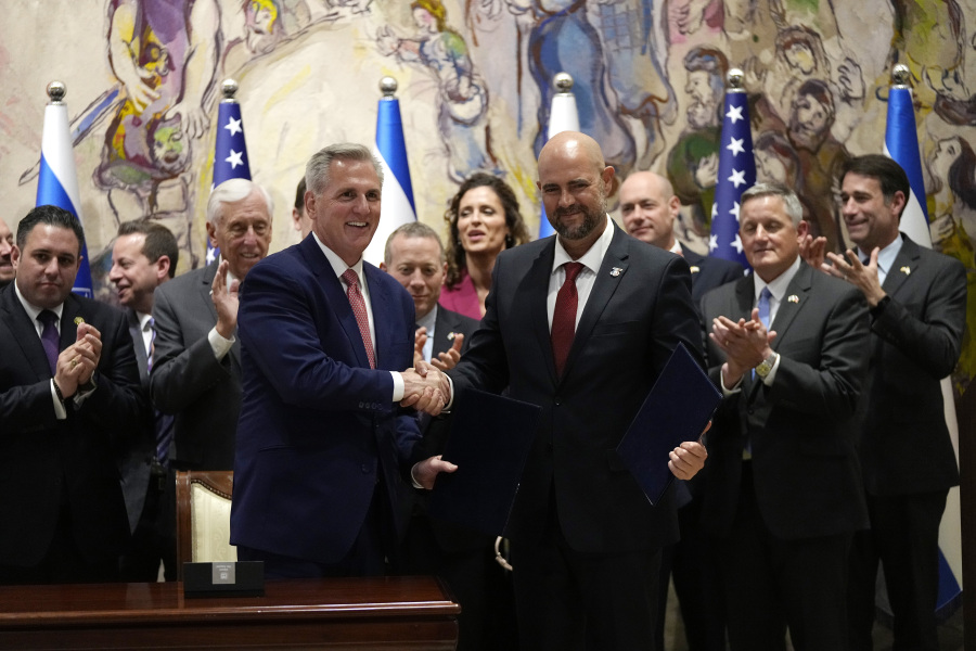 U.S. Speaker of the House Kevin McCarthy, left, and his counterpart Amir Ohana, Speaker of the Knesset, Israel's parliament, after they signed a joint declaration and pledge of friendship between the two speakers, following a Knesset session in Jerusalem, Monday, May 1, 2023.