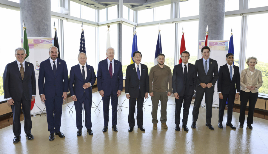 President Joe Biden, fourth from left, and Ukrainian President Volodymyr Zelenskyy, fifth from right, and other G7 leaders pose for a photo before a working session on Ukraine during the G7 Summit in Hiroshima, Japan, Sunday, May 21, 2023. Other leaders from right to left, European Commission President Ursula von der Leyen, Britain's Prime Minister Rishi Sunak, Canada's Prime Minister Justin Trudeau, France's President Emmanuel Macron, Zelenskyy, Japan's Prime Minister Fumio Kishida, Biden, German Chancellor Olaf Scholz, and European Council President Charles Michel and Gianluigi Benedetti, Italian ambassador to Japan.