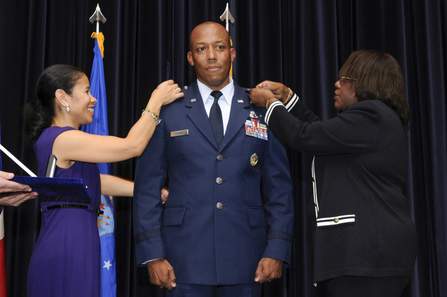 In this image provided by the U.S. Air Force, Air Force Chief of Staff Gen. C.Q. Brown Jr.'s wife, Sharene Brown, left, and mother, Kay Brown, right, pin on Brown's first star during his promotion to brigadier general on Sept. 18, 2009, at Aviano Air Base, Italy. President Joe Biden is expected to announce Air Force Gen. C.Q. Brown Jr., a history-making fighter pilot with recent experience countering China in the Pacific, to serve as the next chairman of the Joint Chiefs of Staff. If confirmed by the Senate, Brown would replace the current chairman of the Joint Chiefs of Staff, Army Gen. Mark Milley, whose term ends in October. (Staff Sgt. Patrick Dixon/U.S.