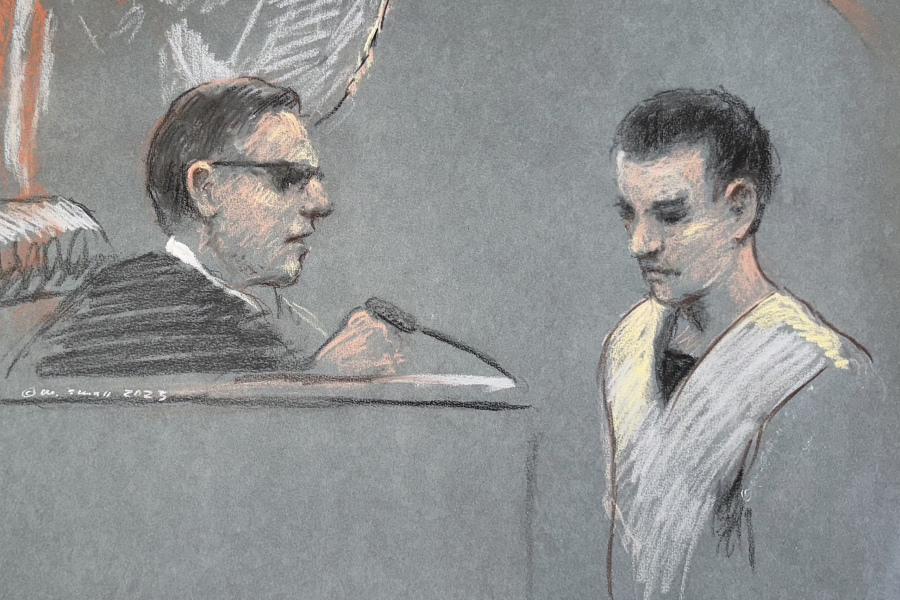 FILE - This artist depiction shows Massachusetts Air National Guardsman Jack Teixeira, right, appearing in U.S. District Court in Boston, April 14, 2023. A judge is poised to decide whether the Massachusetts Air National Guard members accused of leaking highly classified military documents will remain behind bars while he awaits trial.
