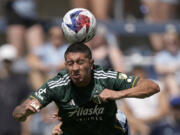 Portland Timbers midfielder Marvin Lor?a heads the ball during the second half of an MLS soccer match against the Sporting Kansas City Sunday, May 28, 2023, in Kansas City, Kan. Sporting Kansas City won 4-1.