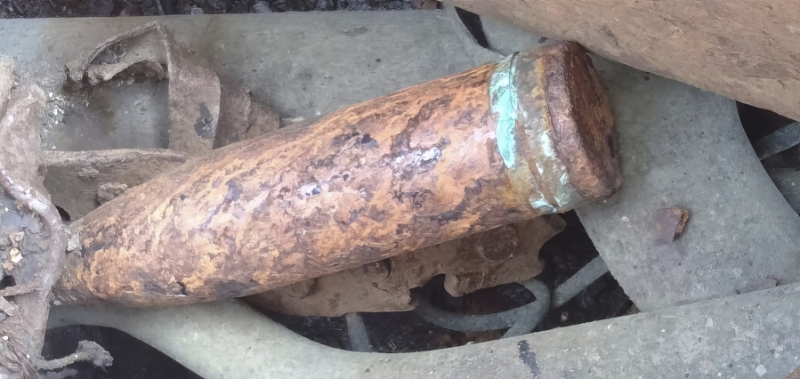 This undated photo released by the Malaysian Maritime Enforcement Agency (MMEA) on Monday, May 29, 2023, show scrap metal and an old cannon shell on a Chinese-registered vessel after detained by MMEA in the waters of east Johor. Malaysia's maritime agency said Monday it found a cannon shell believed to be from World War II on a Chinese-registered vessel and was investigating if the barge carrier was involved in the looting of two British warship wrecks in the South China Sea.