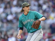 Seattle Mariners starting pitcher Logan Gilbert prepares to deliver in the first inning of a baseball game against the Atlanta Braves , Saturday, May 20, 2023, in Atlanta.