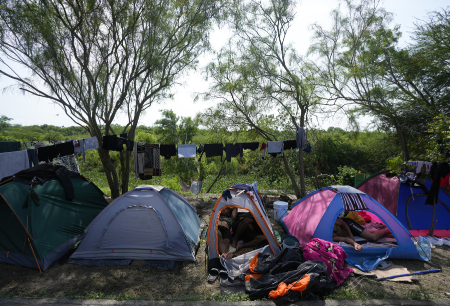 Venezuelan migrants rest inside their tents on the bank of the Rio Grande in Matamoros, Mexico, Sunday, May 14, 2023. As the U.S. ended its pandemic-era immigration restrictions, migrants are adapting to new asylum rules and legal pathways meant to discourage illegal crossings.