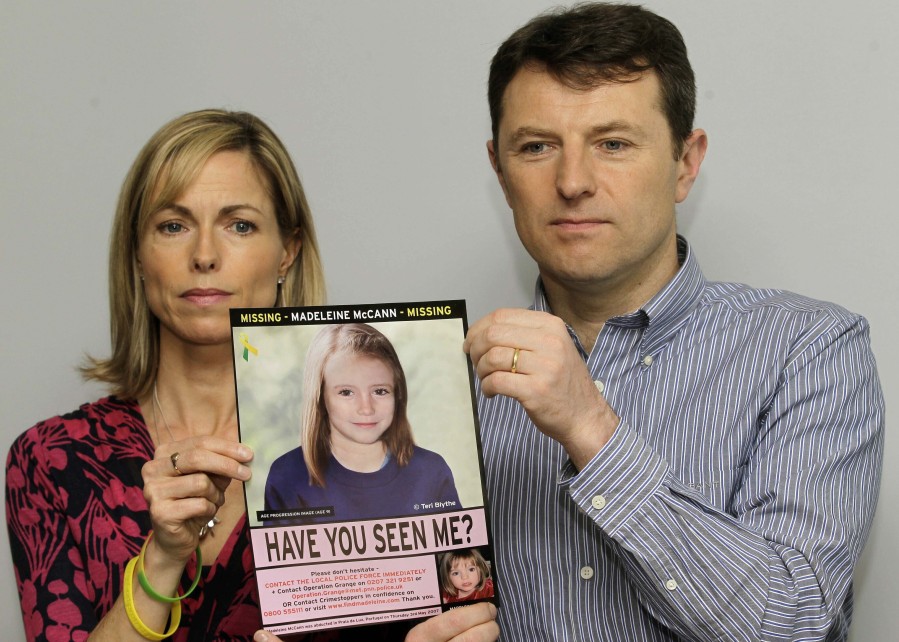 FILE - Kate and Gerry McCann pose for the media with a missing poster depicting an age progression computer generated image of their still missing daughter Madeleine during a news conference in London, May 2, 2012. Portuguese police say they'll resume searching for Madeleine McCann, the British toddler who disappeared in the country's Algarve region in 2007, in the next few days.Portugal's Judicial Police released a statement confirming local media reports that they would conduct the search at the request of the German authorities and in the presence of British officials.