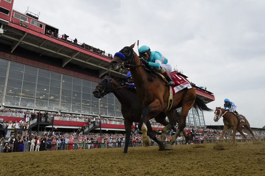 National Treasure, with jockey John Velazquez, edges out Blazing Sevens, with jockey Irad Ortiz Jr., to win the148th running of the Preakness Stakes horse race at Pimlico Race Course, Saturday, May 20, 2023, in Baltimore.