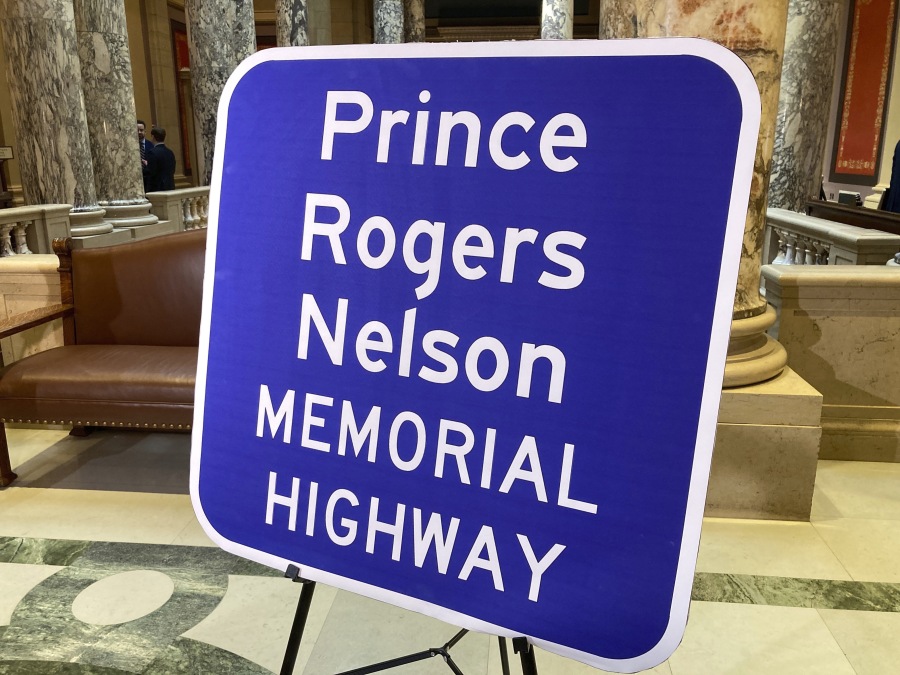 A replica sign stands outside the Minnesota Senate chambers, Thursday, May 4, 2023, in St. Paul, Minn., after the Senate voted to honor the late pop superstar Prince by designating the highway that runs past his Paisley Park museum and studios in Chanhassen, Minn., as the Prince Rogers Nelson Memorial Highway. The signs are expected to go up soon.
