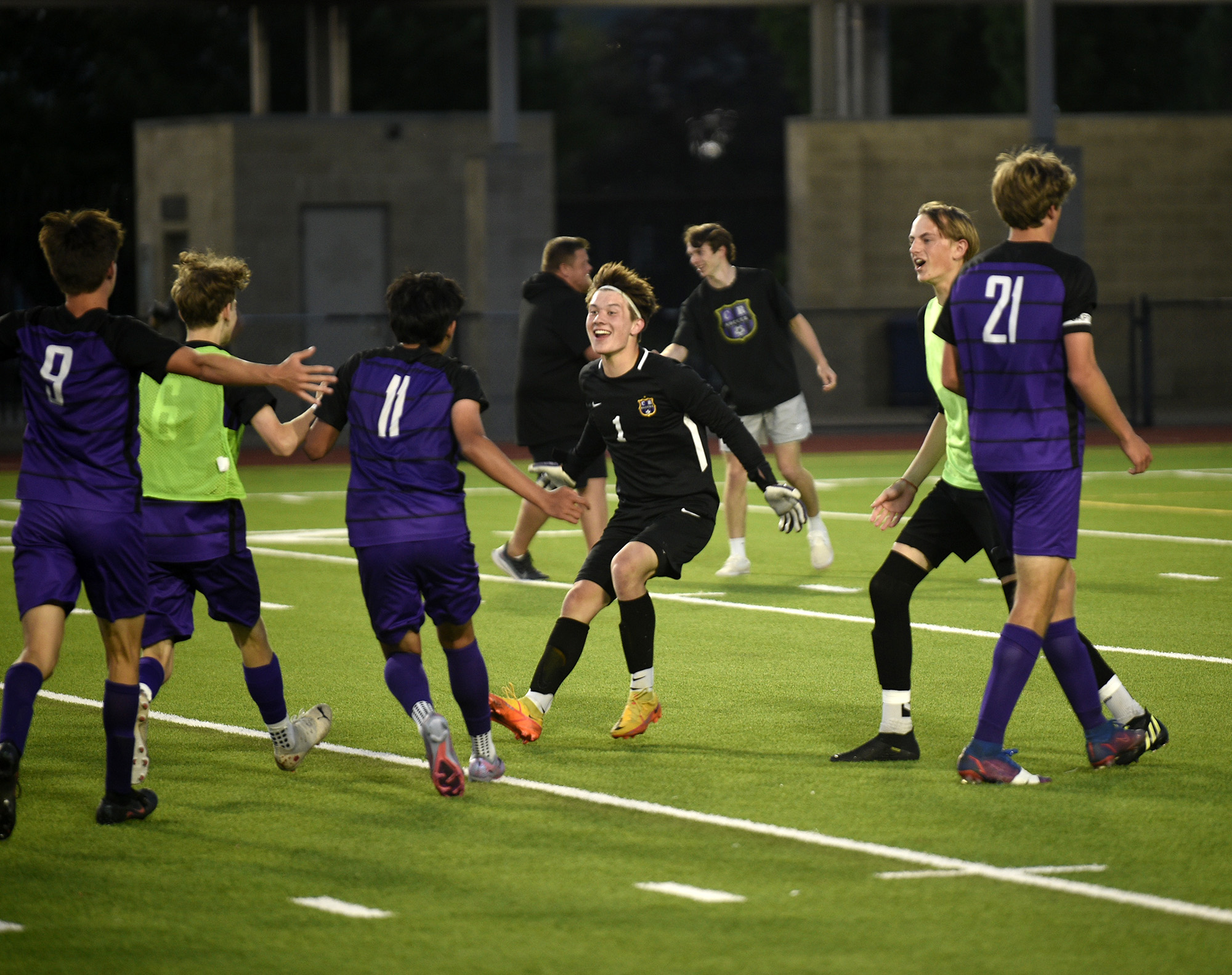 Columbia River goalkeeper Cameron Harris (1) joins his teammates in celebration after the Rapids' 2-1 win over Sehome in the Class 2A boys soccer state semifinal at Renton Memorial Stadium on Friday, May 26, 2023.