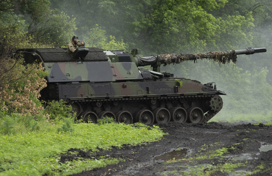 A Ukrainian army, German self-propelled Panzerhaubitze 2000, artillery is seen at its position at the frontline near Bakhmut, Donetsk region, Ukraine, Saturday, May 27, 2023.