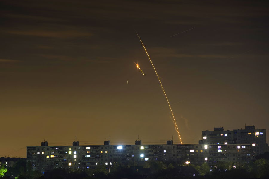 Russian rockets launch against Ukraine from Russia's Belgorod region are seen at dawn in Kharkiv, Ukraine, early Sunday, May 14, 2023.