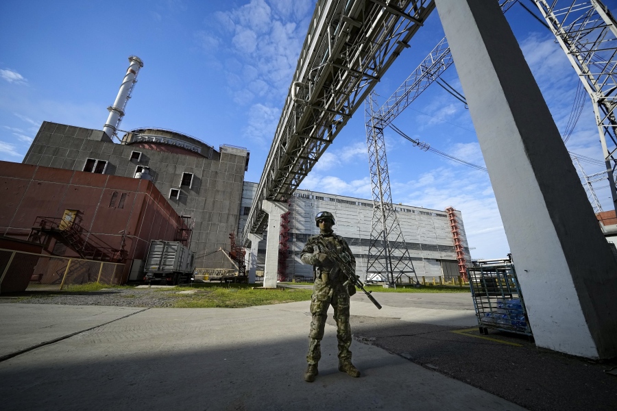 FILE - A Russian serviceman guards in an area of the Zaporizhzhia Nuclear Power Station in territory under Russian military control, southeastern Ukraine, May 1, 2022. The head of the United Nations' nuclear watchdog Rafael Grossi is expressing growing anxiety about the safety of the Zaporizhzhia Nuclear Power Plant, after the governor of the Russia-occupied area ordered the evacuation of a town where most plant staff live amid ongoing attacks in the area.