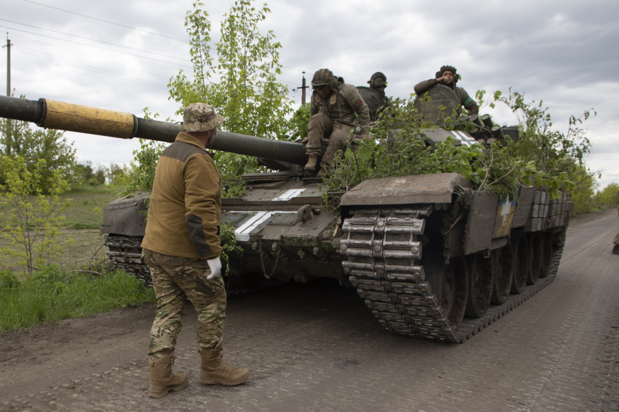 A Ukrainian tank rides on the road near Bakhmut, Donetsk region, Ukraine, Thursday, May 11, 2023.