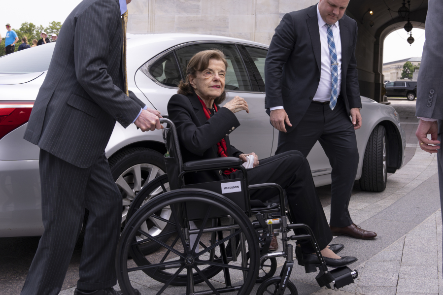 Sen. Dianne Feinstein, D-Calif., is assisted to a wheelchair by staff as she returns to the Senate after a more than two-month absence, at the Capitol in Washington, Wednesday, May 10, 2023. The 89-year-old California Democrat was out longer than expected which has slowed the push to confirm President Joe Biden's judicial nominees. (AP Photo/J.