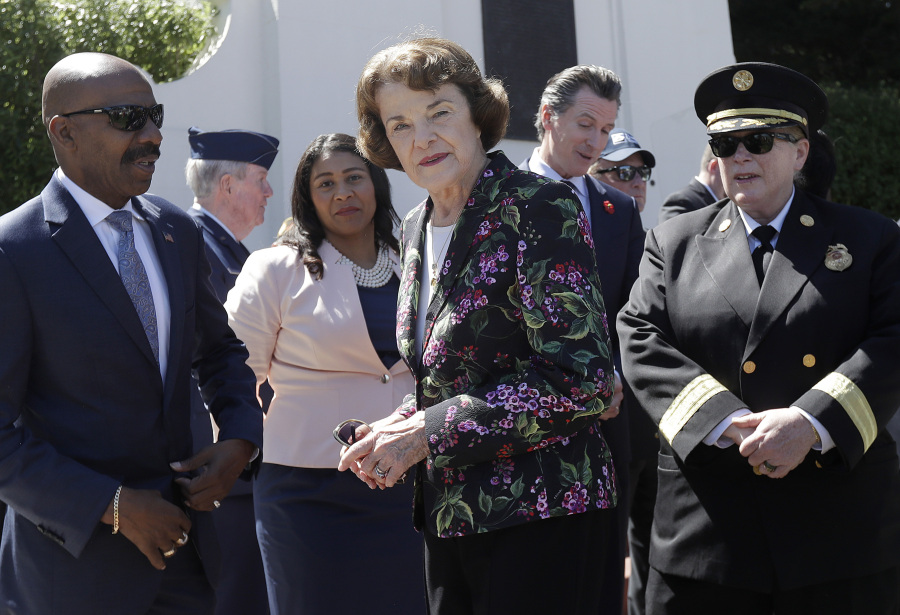 FILE - Kenneth C. Johnson of the National Cemetery Administration, from left, stands with San Francisco mayoral candidate and Board of Supervisors President London Breed, Sen. Dianne Feinstein, D-Calif., California Lt. Gov. Gavin Newsom and San Francisco Fire Chief Joanne Hayes-White at a Memorial Day Commemoration at San Francisco National Cemetery in the Presidio in San Francisco, May 28, 2018. Feinstein's ongoing medical struggles have raised a sensitive political question with no easy answer: Who would California Democratic Gov. Newsom pick to replace her if the seat became vacant?