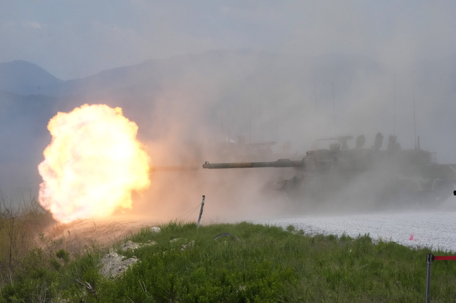The South Korean army's K-2 tank fires during South Korea-U.S. joint military drills at Seungjin Fire Training Field in Pocheon, South Korea, Thursday, May 25, 2023. The South Korean and U.S. militaries held massive live-fire drills near the border with North Korea on Thursday, despite the North's warning that it won't tolerate what it calls such a hostile invasion rehearsal on its doorstep.