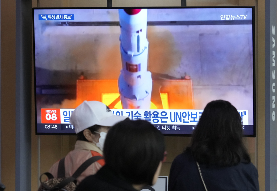 A TV screen shows a file image of North Korea's rocket launch during a news program at the Seoul Railway Station in Seoul, South Korea, Monday, May 29, 2023. Japan's coast guard said North Korea has notified it that it plans to launch a satellite in coming days.